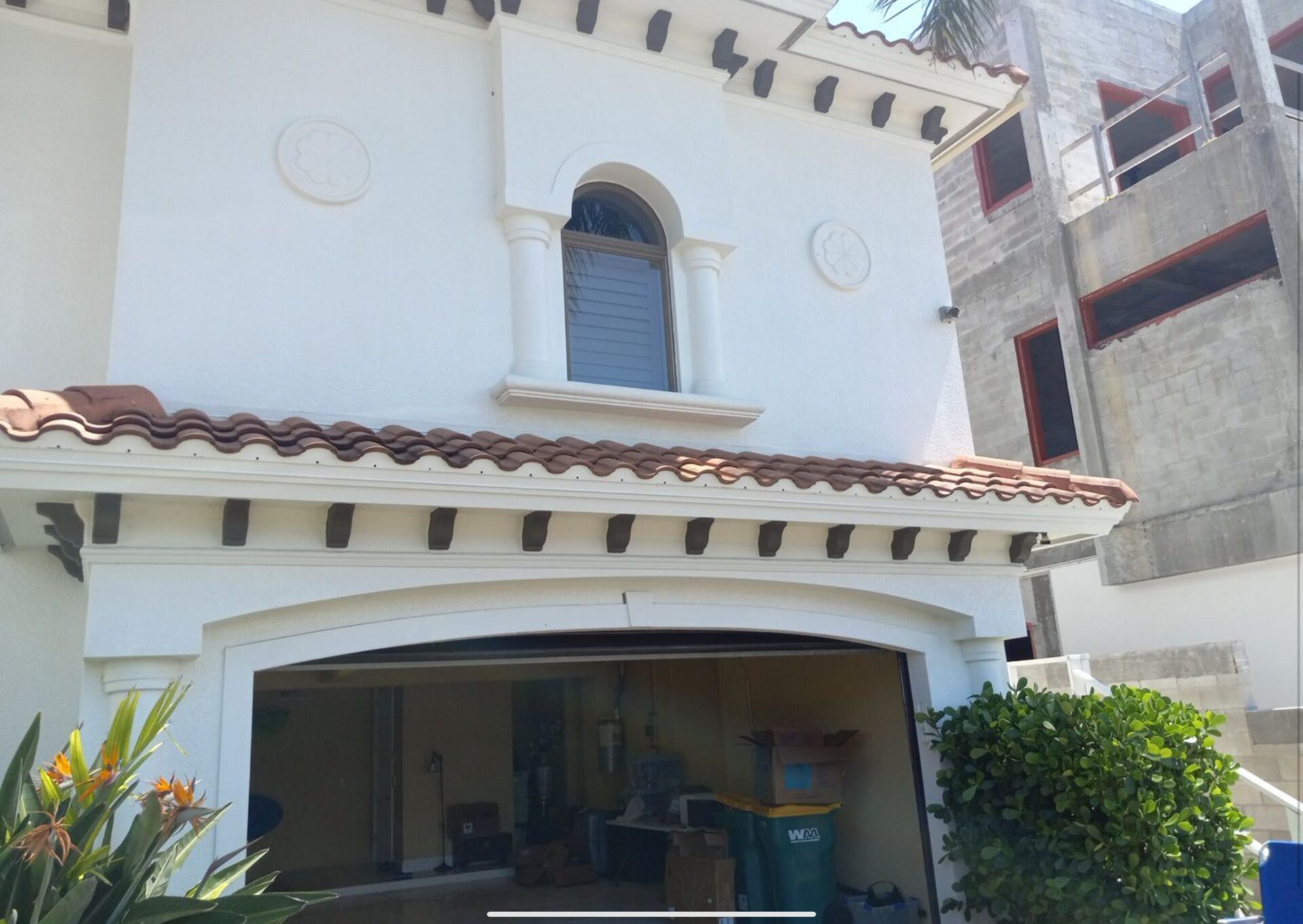 before photo of an old spanish clay tile roof