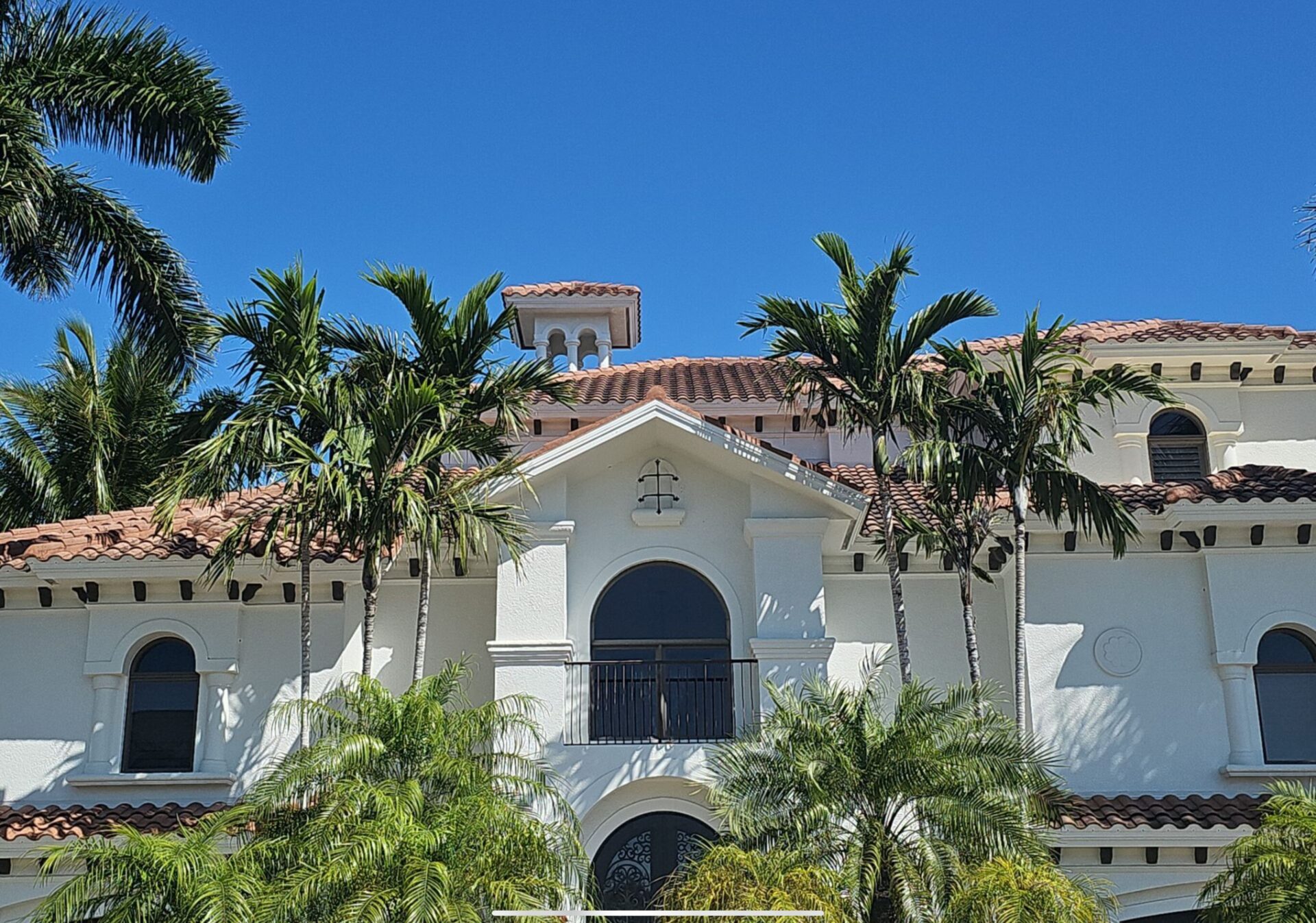 before photo of old spanish clay tile roofing